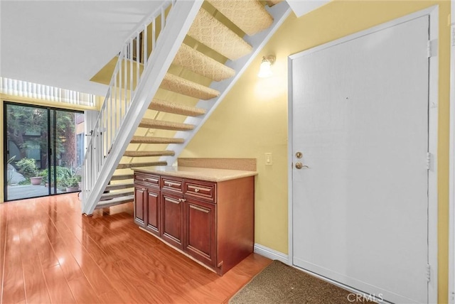 10642 Shoreline Dr Unit 80, Norwalk, CA 90650 - stairway featuring wood finished floors