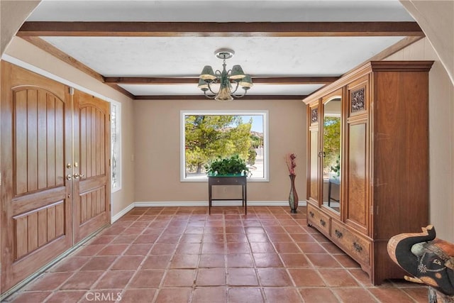 19955 Chickasaw Rd, Apple Valley, CA 92307 - tiled entryway featuring beamed ceiling and a chandelier