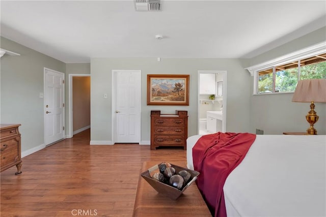 19955 Chickasaw Rd, Apple Valley, CA 92307 - bedroom featuring wood finished floors and ensuite bathroom