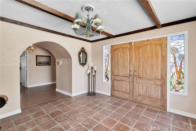 19955 Chickasaw Rd, Apple Valley, CA 92307 - entryway with a chandelier, beamed ceiling, and arched walkways