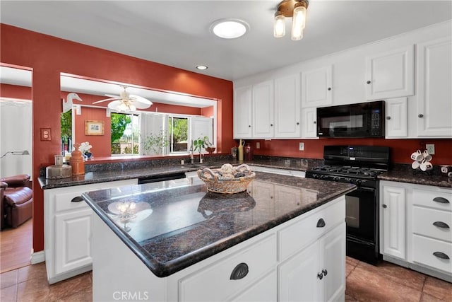 19955 Chickasaw Rd, Apple Valley, CA 92307 - kitchen featuring black appliances, a kitchen island, light tile patterned floors, white cabinetry, and dark stone counters