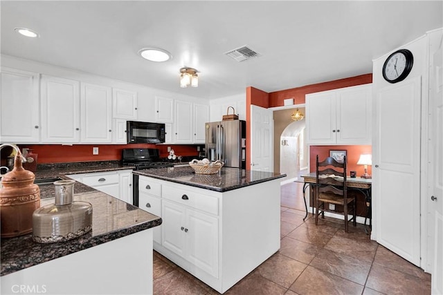 19955 Chickasaw Rd, Apple Valley, CA 92307 - kitchen featuring stainless steel fridge with ice dispenser, black microwave, gas range oven, a center island, and white cabinetry