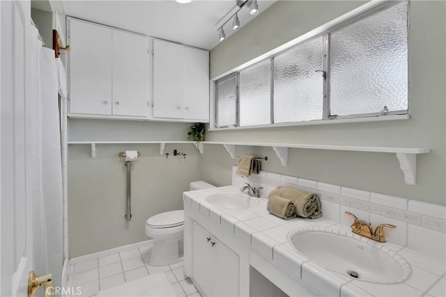 19955 Chickasaw Rd, Apple Valley, CA 92307 - full bath with double vanity, tile patterned floors, and a shower with curtain