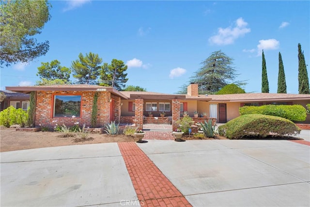 19955 Chickasaw Rd, Apple Valley, CA 92307 - ranch-style house with a chimney and brick siding