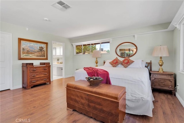 19955 Chickasaw Rd, Apple Valley, CA 92307 - bedroom with wood finished floors and ensuite bath