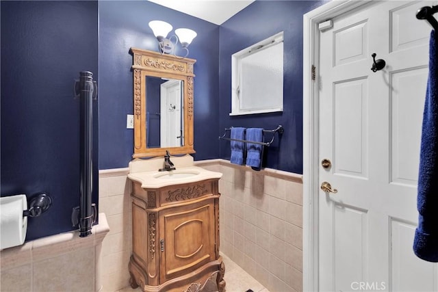 19955 Chickasaw Rd, Apple Valley, CA 92307 - bathroom with tile walls, vanity, and wainscoting
