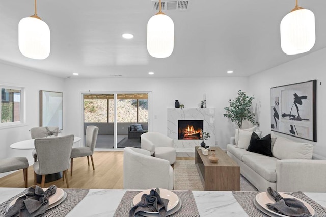 1654 Yale St, Chula Vista, CA 91913 - living area featuring light wood-type flooring, recessed lighting, and a premium fireplace