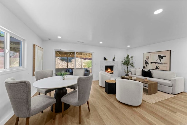 1654 Yale St, Chula Vista, CA 91913 - dining space featuring light wood-style flooring, a high end fireplace, and recessed lighting
