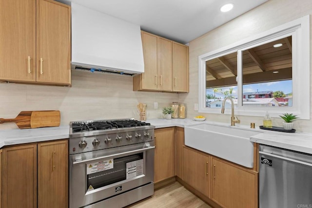 1654 Yale St, Chula Vista, CA 91913 - kitchen featuring stainless steel appliances, decorative backsplash, recessed lighting, extractor fan, and light stone countertops
