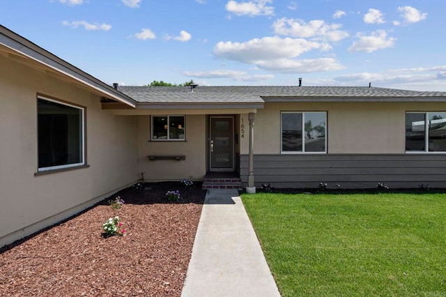 1654 Yale St, Chula Vista, CA 91913 - property entrance with a lawn, stucco siding, and roof with shingles