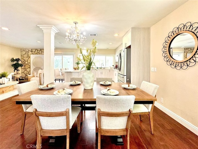 21315 Pinehill Ln, Diamond Bar, CA 91765 - dining space featuring dark wood-type flooring, a chandelier, decorative columns, and recessed lighting