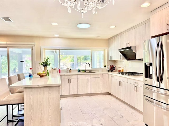 21315 Pinehill Ln, Diamond Bar, CA 91765 - kitchen featuring stainless steel appliances, a breakfast bar, light countertops, range hood, and a chandelier
