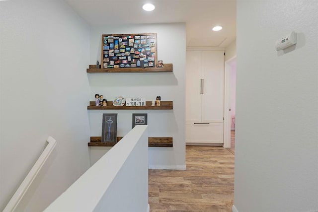 1148 Valdivia Ct, Chula Vista, CA 91910 - corridor featuring wood finished floors, recessed lighting, and an upstairs landing