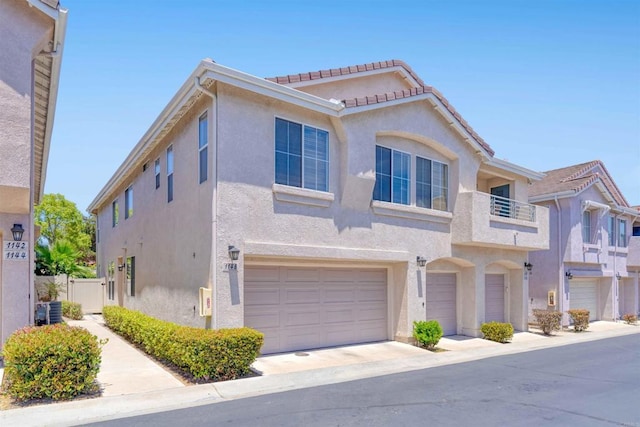 1148 Valdivia Ct, Chula Vista, CA 91910 - mediterranean / spanish-style home with stucco siding, a balcony, a garage, and a tiled roof