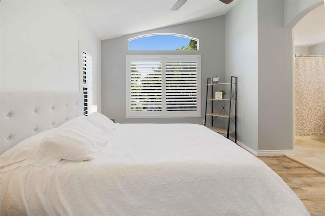 1148 Valdivia Ct, Chula Vista, CA 91910 - bedroom with arched walkways, vaulted ceiling, wood finished floors, ceiling fan, and connected bathroom