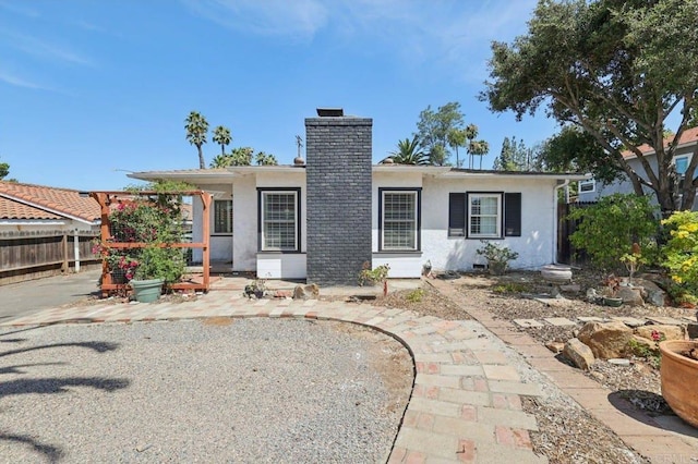 1220 Palomar Ter, Escondido, CA 92027 - view of front of house featuring a chimney, stucco siding, and a patio
