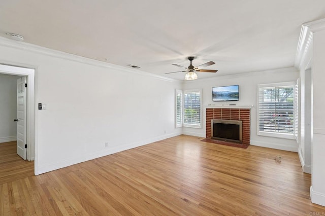 1220 Palomar Ter, Escondido, CA 92027 - unfurnished living room with ceiling fan, crown molding, healthy amount of natural light, light wood finished floors, and a brick fireplace
