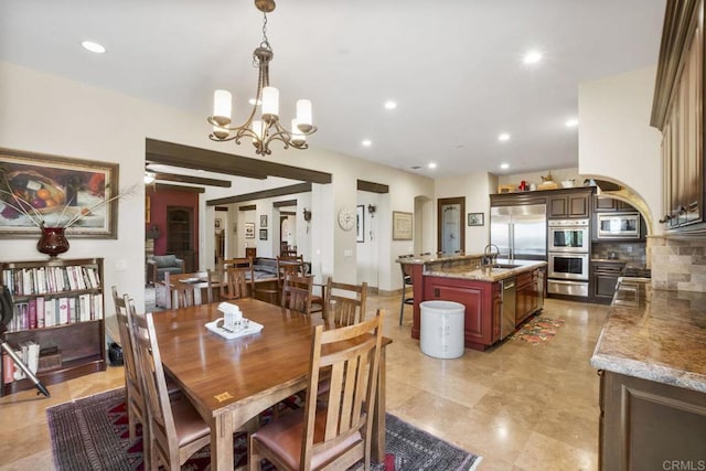 14786 Cool Valley Ranch Rd, Valley Center, CA 92082 - dining room with arched walkways, a chandelier, and recessed lighting