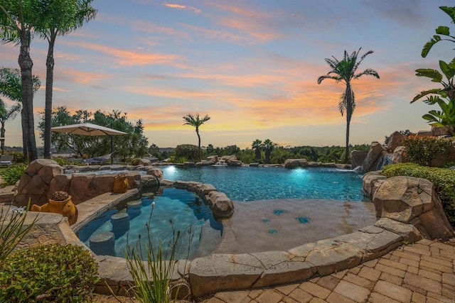 14786 Cool Valley Ranch Rd, Valley Center, CA 92082 - pool at dusk featuring a pool with connected hot tub