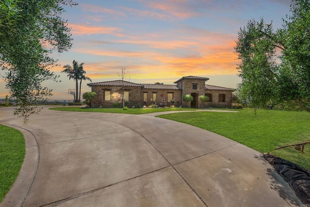 14786 Cool Valley Ranch Rd, Valley Center, CA 92082 - mediterranean / spanish-style house with a tile roof, curved driveway, stone siding, and a lawn