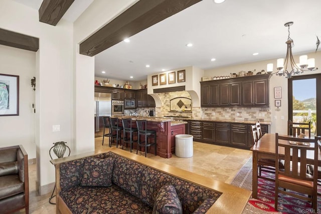 14786 Cool Valley Ranch Rd, Valley Center, CA 92082 - kitchen featuring built in appliances, decorative backsplash, a breakfast bar area, dark brown cabinets, and recessed lighting