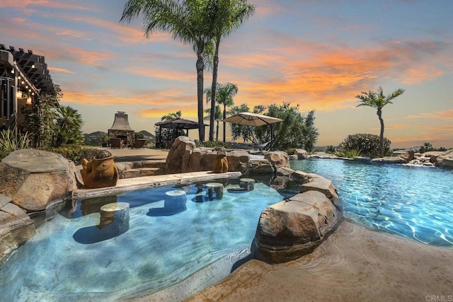 14786 Cool Valley Ranch Rd, Valley Center, CA 92082 - swimming pool featuring a fireplace