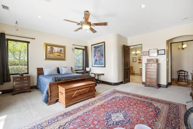 14786 Cool Valley Ranch Rd, Valley Center, CA 92082 - bedroom featuring light colored carpet, a chandelier, arched walkways, recessed lighting, and a ceiling fan