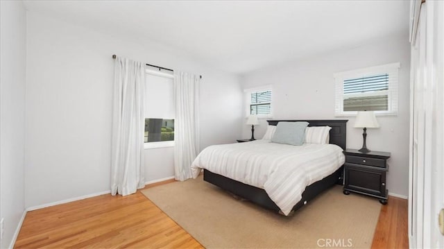 1193 Winston Ct, Upland, CA 91786 - bedroom featuring light wood-type flooring and baseboards