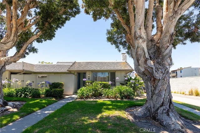 1841 Fisher Dr Unit B, Oxnard, CA 93035 - view of front of house featuring a chimney, a front yard, and roof with shingles