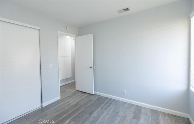 1841 Fisher Dr Unit B, Oxnard, CA 93035 - unfurnished bedroom with wood finished floors and a closet