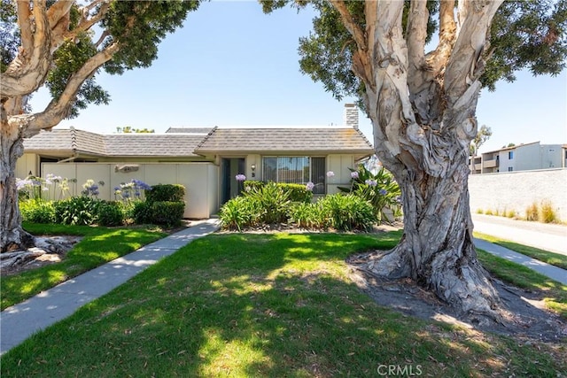 1841 Fisher Dr Unit B, Oxnard, CA 93035 - view of front of house with a front yard, a chimney, and roof with shingles