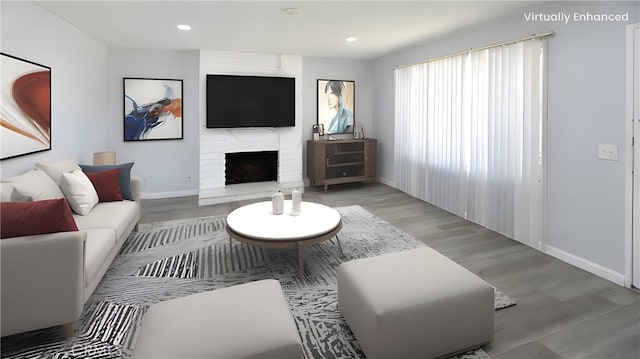 1841 Fisher Dr Unit B, Oxnard, CA 93035 - living room featuring light wood-style flooring, recessed lighting, and a fireplace
