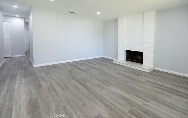1841 Fisher Dr Unit B, Oxnard, CA 93035 - unfurnished living room featuring wood finished floors, recessed lighting, and a fireplace