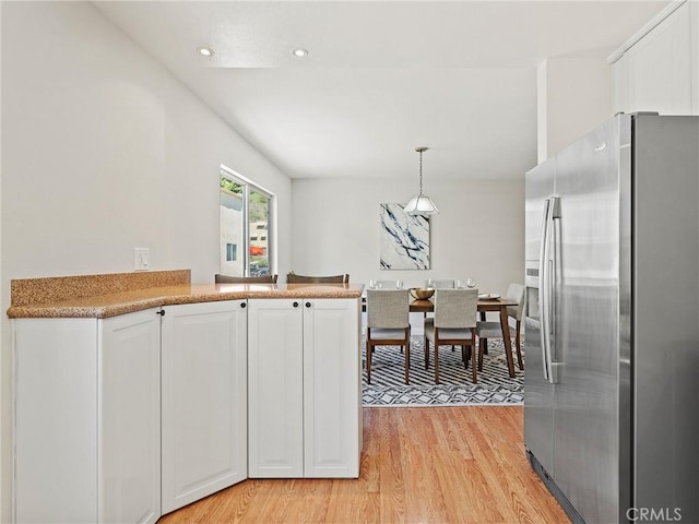 9531 Via Ricardo, Sun Valley, CA 91504 - kitchen featuring stainless steel fridge, white cabinets, light wood finished floors, pendant lighting, and recessed lighting