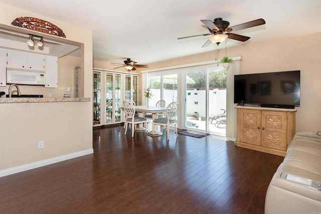 836 Yankee Point Way, Oceanside, CA 92058 - living room featuring ceiling fan and dark wood-style flooring