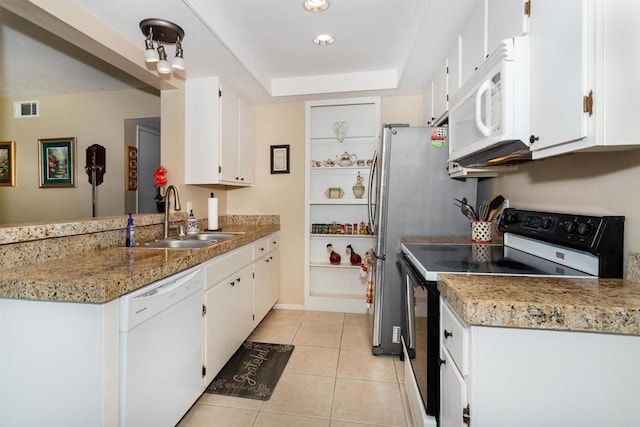 836 Yankee Point Way, Oceanside, CA 92058 - kitchen featuring white appliances, white cabinetry, light tile patterned floors, and a peninsula