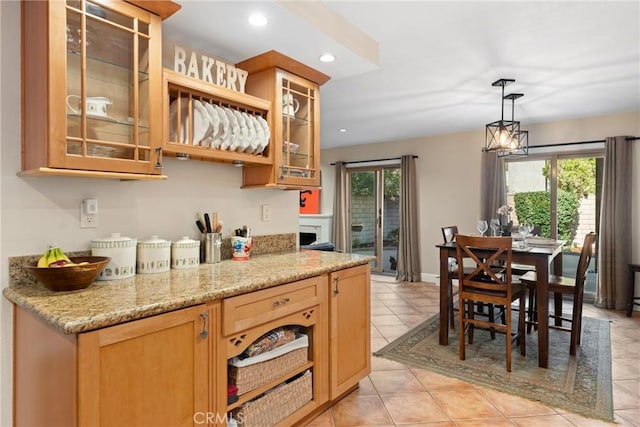 887 San Juan Cir, Duarte, CA 91010 - kitchen with plenty of natural light, recessed lighting, pendant lighting, light tile patterned floors, and glass insert cabinets