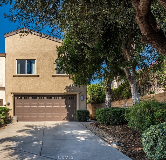 887 San Juan Cir, Duarte, CA 91010 - mediterranean / spanish house featuring stucco siding, concrete driveway, and a garage