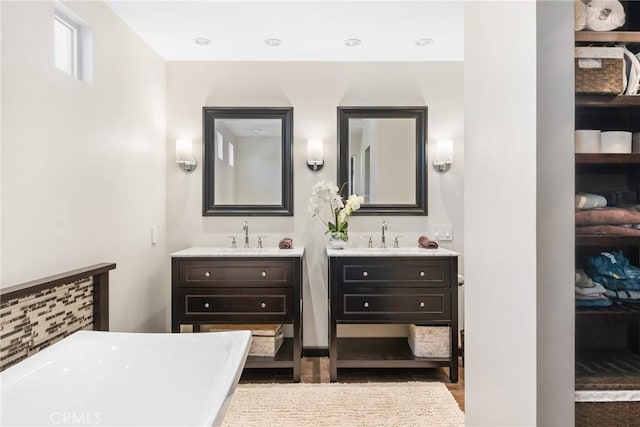 887 San Juan Cir, Duarte, CA 91010 - bathroom featuring a soaking tub, two vanities, and wood finished floors