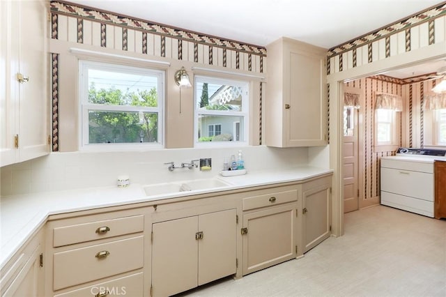 845 N Curtis Ave, Alhambra, CA 91801 - kitchen with washer / dryer, light countertops, and backsplash