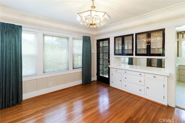 845 N Curtis Ave, Alhambra, CA 91801 - unfurnished dining area featuring a chandelier, wood finished floors, and crown molding