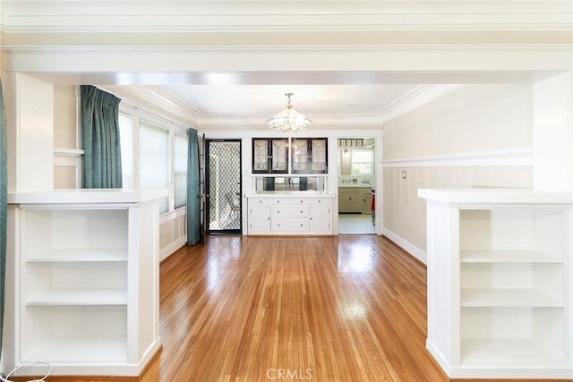 845 N Curtis Ave, Alhambra, CA 91801 - unfurnished living room featuring a chandelier, light wood-style flooring, crown molding, and built in features