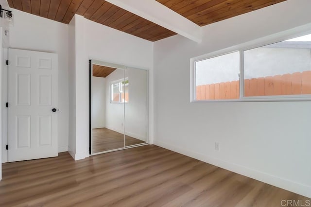 9753 Ivanho St, Spring Valley, CA 91977 - unfurnished bedroom featuring a wooden ceiling with exposed beams, a closet, and wood finished floors