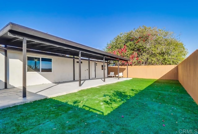 9753 Ivanho St, Spring Valley, CA 91977 - rear view of house with a fenced backyard, a patio, and stucco siding