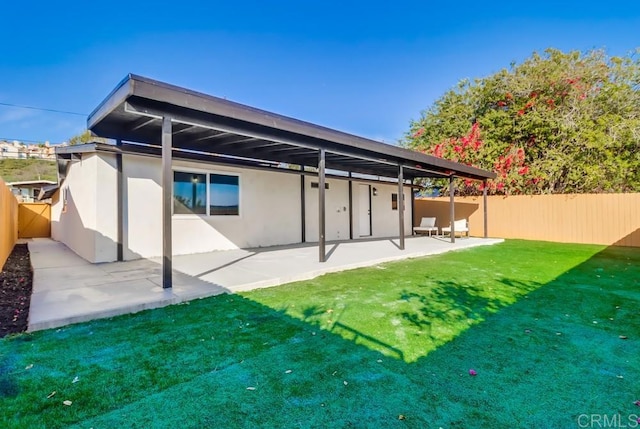 9753 Ivanho St, Spring Valley, CA 91977 - rear view of property featuring a fenced backyard, stucco siding, and a patio area