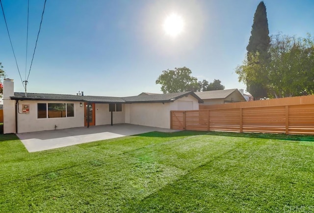 9753 Ivanho St, Spring Valley, CA 91977 - back of property with a patio, a fenced backyard, a chimney, and stucco siding