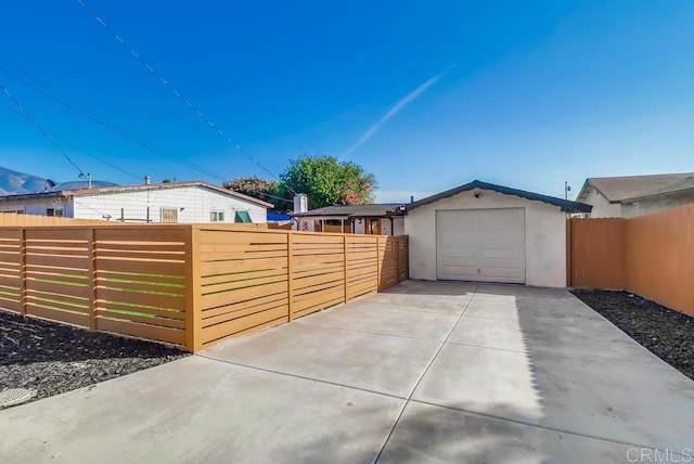 9753 Ivanho St, Spring Valley, CA 91977 - view of yard with a garage and concrete driveway