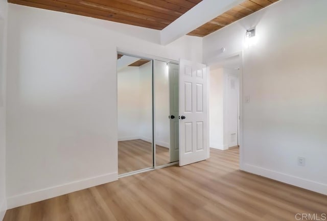9753 Ivanho St, Spring Valley, CA 91977 - unfurnished bedroom with a wooden ceiling with exposed beams, light wood finished floors, and a closet