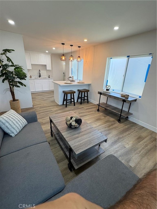 1526 W 54th St, Los Angeles, CA 90062 - living area featuring recessed lighting, light wood-style flooring, and healthy amount of natural light