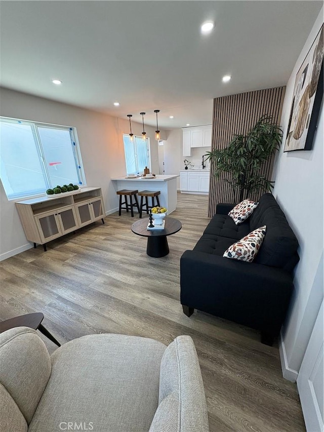 1526 W 54th St, Los Angeles, CA 90062 - living area featuring light wood-style flooring, recessed lighting, and healthy amount of natural light